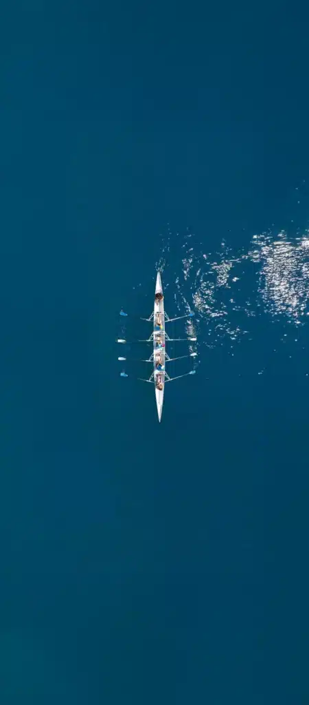 Boat navigating through open waters symbolizing McLean Partnership’s transformative strategic guidance and direction