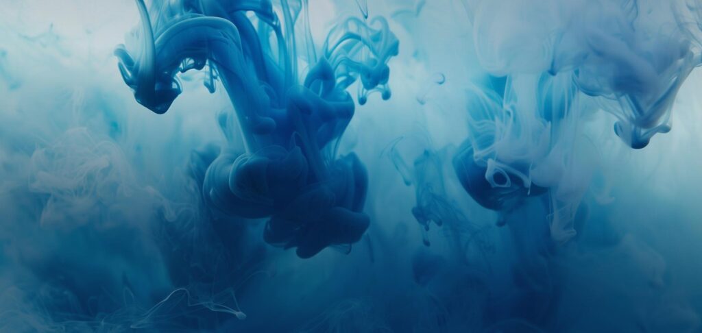 Abstract blue ink swirls representing creativity and innovation at McLean Partnership.