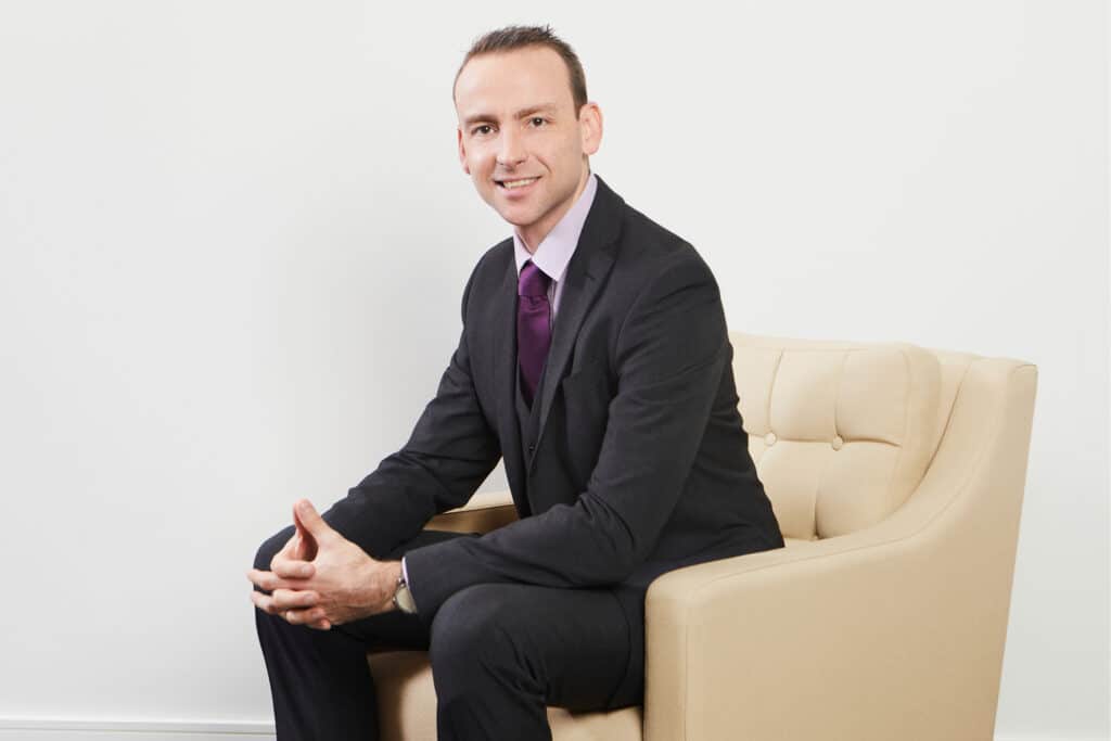 Professional portrait of Caius Freeman, Associate Partner at The McLean Partnership.