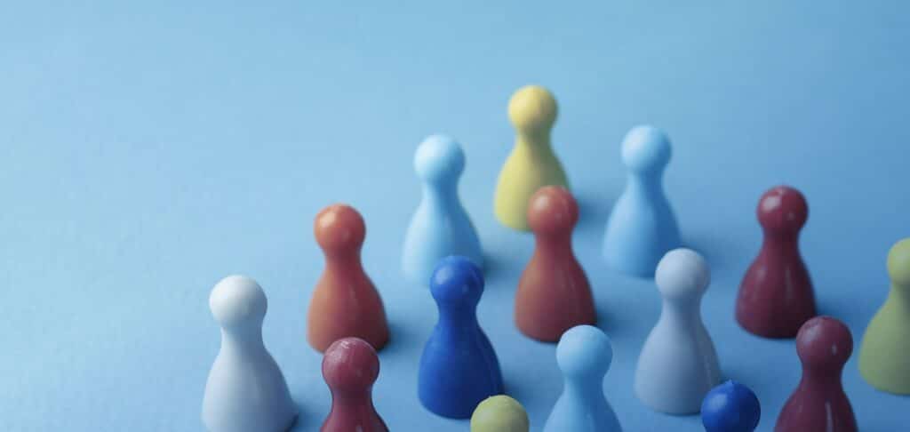 Colourful game pieces representing diversity and inclusion in corporate strategy.