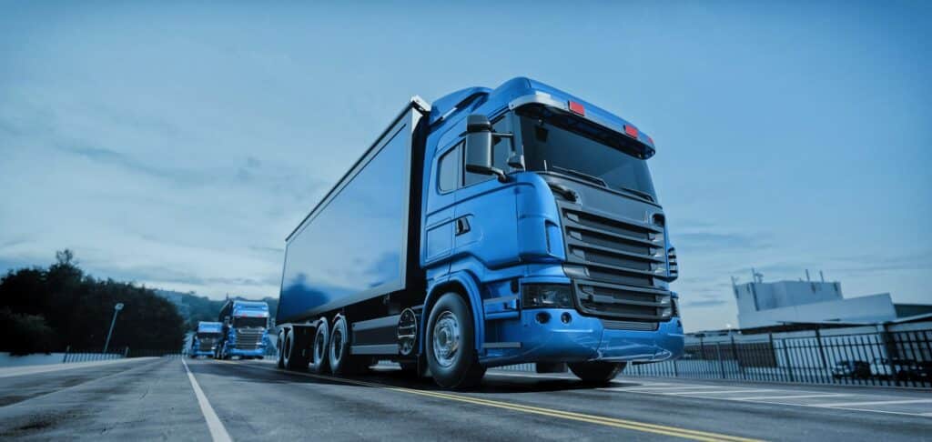 Blue lorry parked at a logistics depot representing a global French logistics company’s finished vehicle operations.