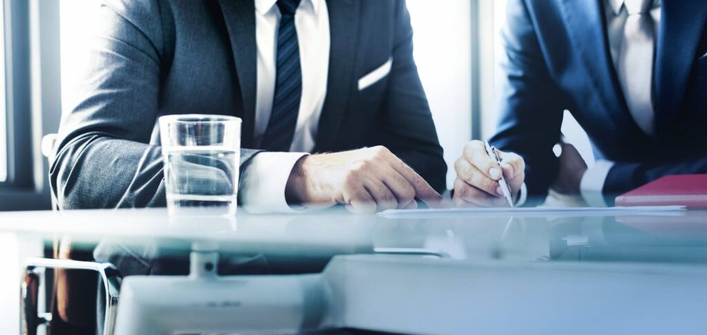 Executives reviewing documents symbolizing the Equity Advisory Partner appointment in Germany.