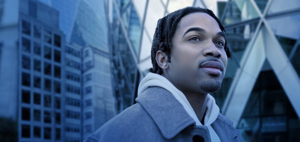 Professional standing in London’s financial district, representing leadership in social investment.