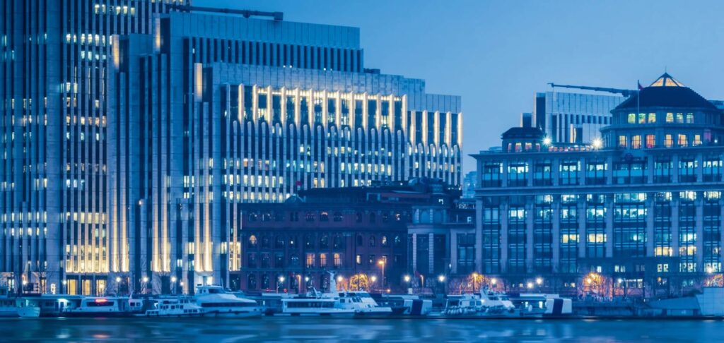 City skyline at dusk symbolising financial growth and private equity leadership.