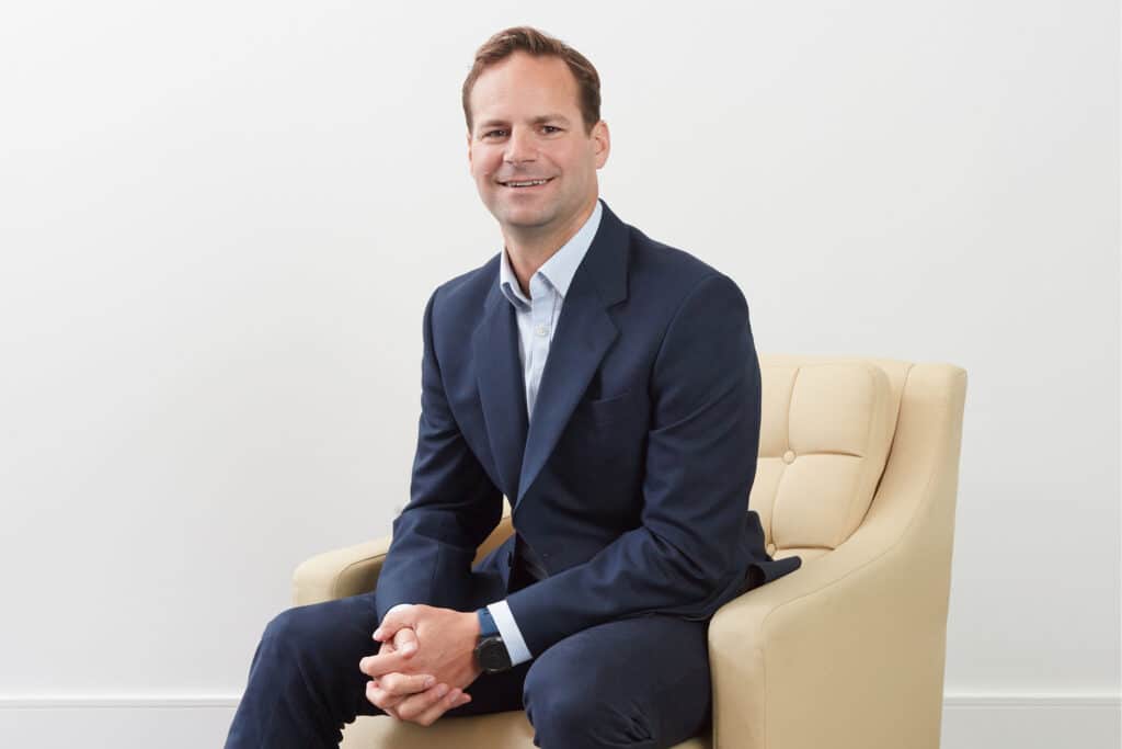 Professional portrait of John Widdowson, Partner at The McLean Partnership.