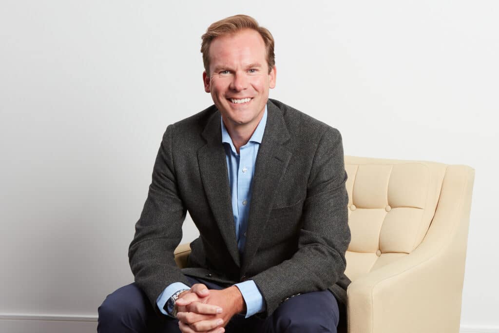 Professional portrait of Nick Gebbie, Chief Executive Officer at The McLean Partnership.