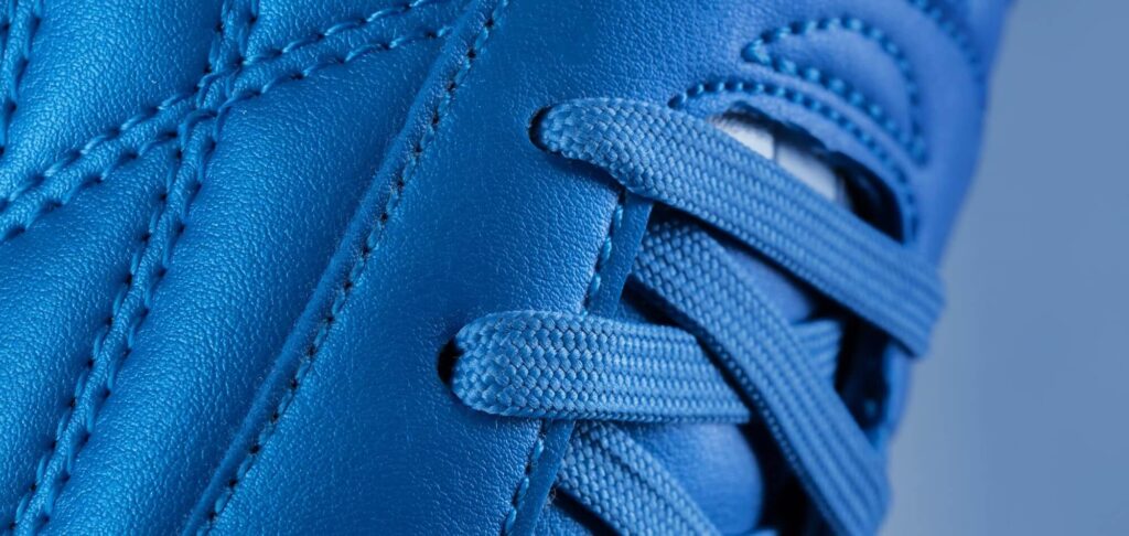 Close-up of a sports shoe, symbolising executive leadership in the retail sector.