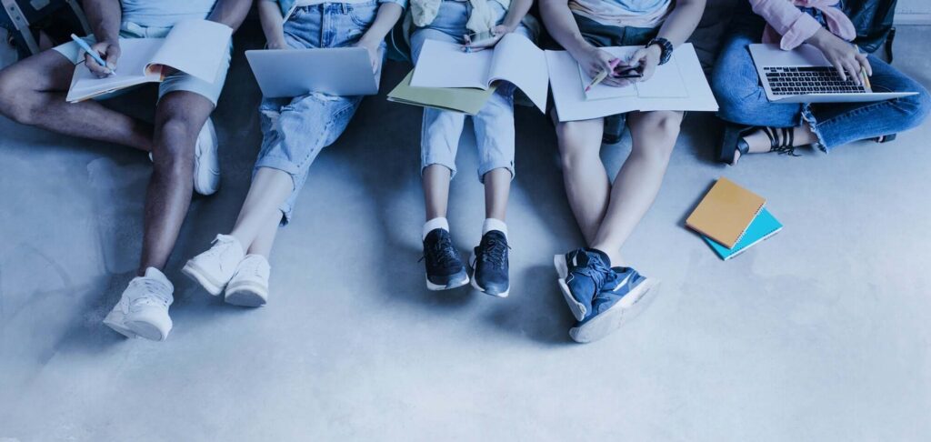 Students working outdoors symbolizing the Interim Director of Financial Reporting role at a Russell Group university