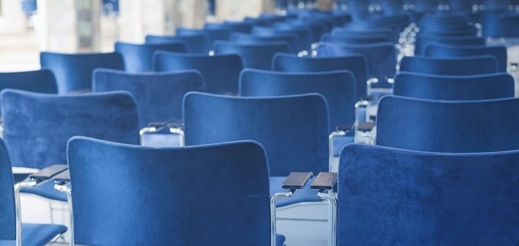 Conference room with empty chairs symbolizing the CEO appointment for a UK awarding body and training provider.