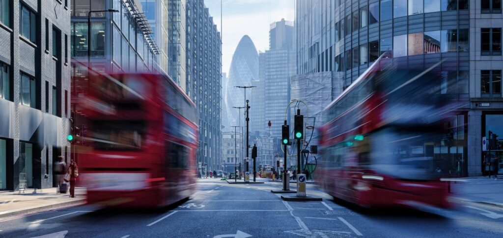 London street view with red buses representing the Group CFO appointment for a UK family office